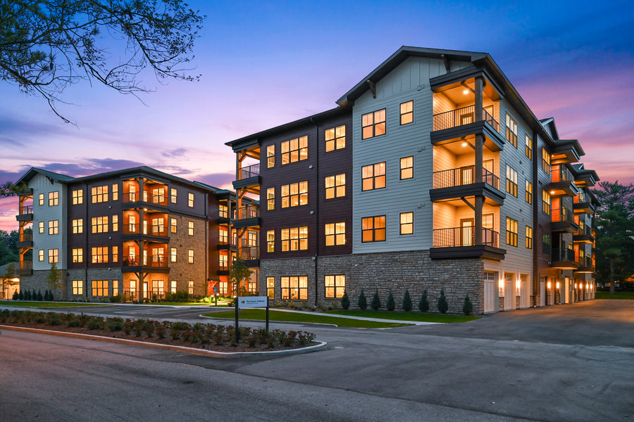 Night image of 4 story senior living complex exterior