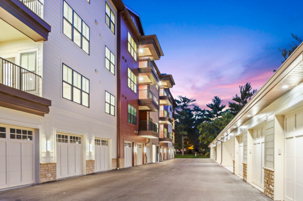 Night image of 4 story senior living complex exterior