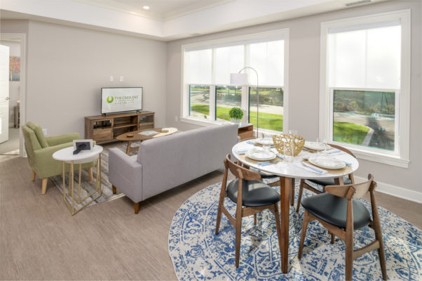 Interior image of living and dining area in a senior living apartment complex